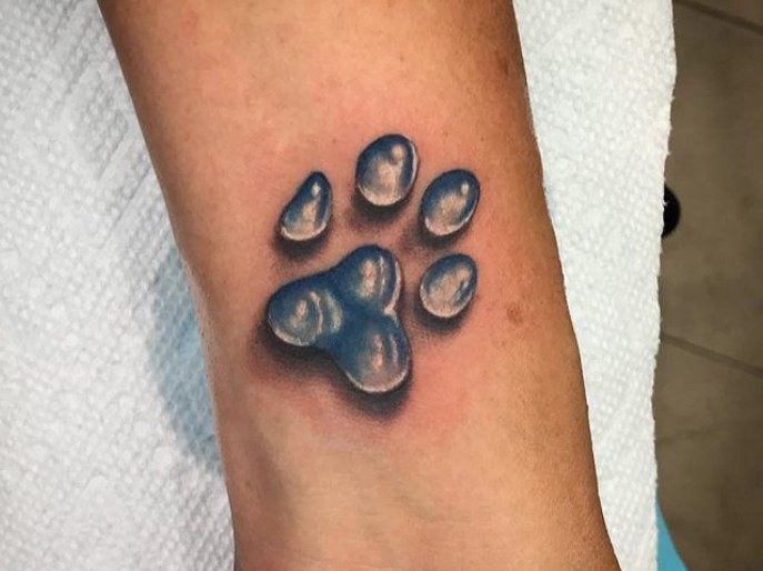 3D paw print tattoo on wrist