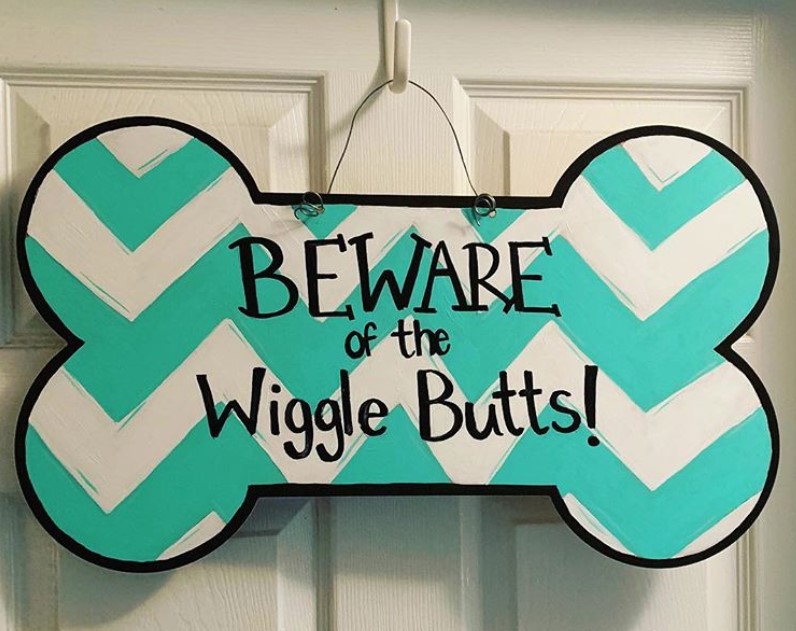 aztec blue green and white bone shape sign board 