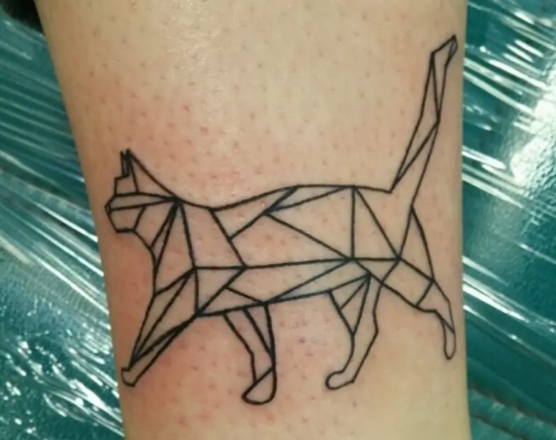 A walking Geometric Cat Tattoo on the leg