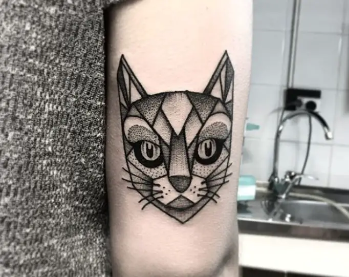 face of a Geometric Cat Tattoo on the triceps