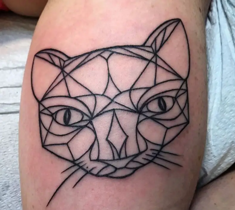A Geometric face of a Cat Tattoo on the leg