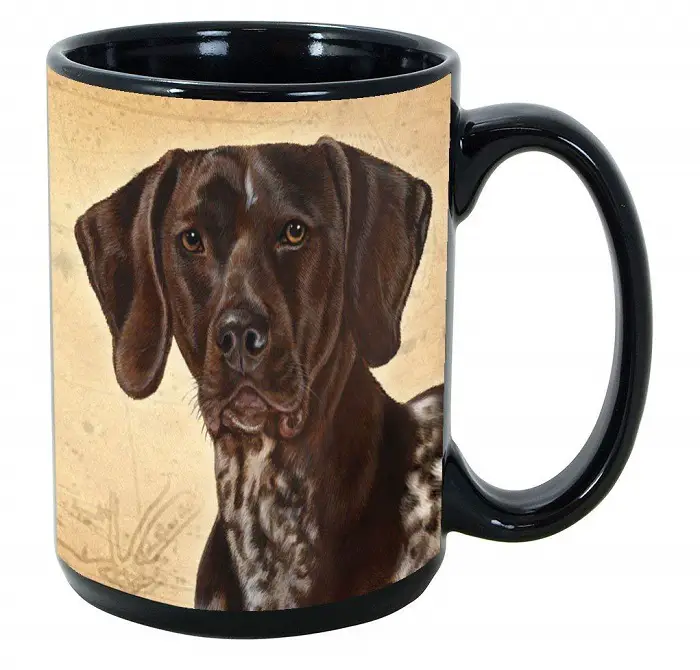 A black mug with the face of a German Shorthaired Pointer