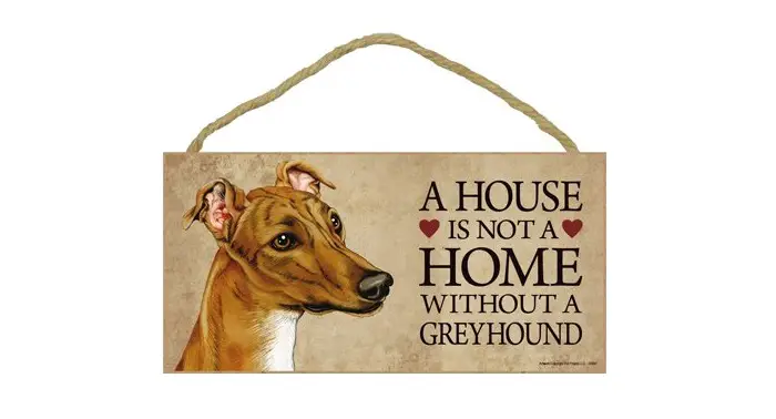 A wooden door sign with the face of a Greyhound and saying - A house is not a home without a Greyhound