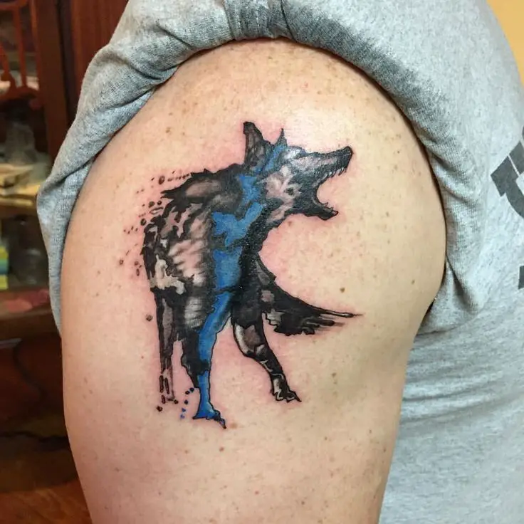 artistic aggressive German Shepherd dog tattoo on the shoulder