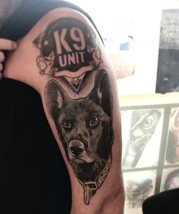K9 UNIT badge and face of the German Shepherd tattoo on the shoulder