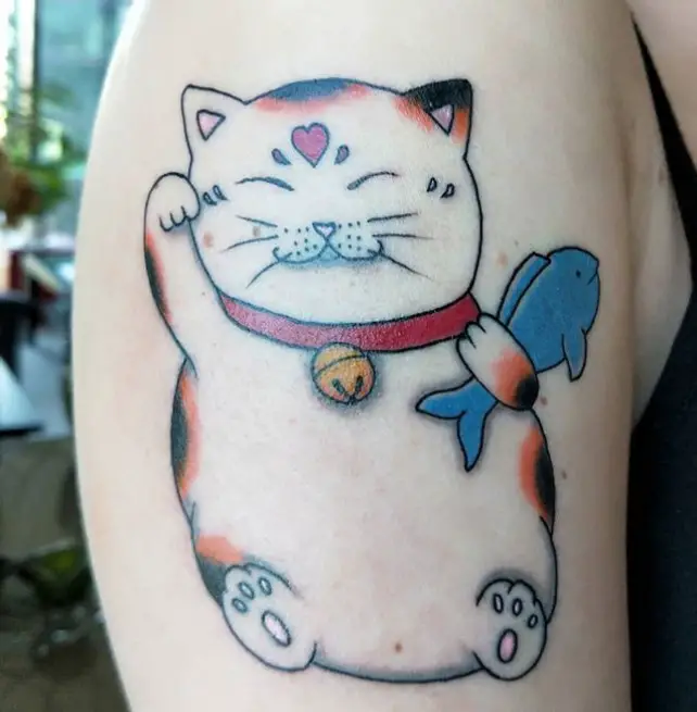 A large Lucky Cat Tattoo on the shoulder