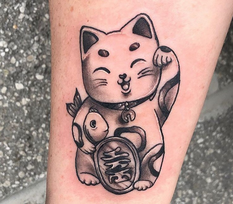 A black and gray Lucky Cat Tattoo on the leg