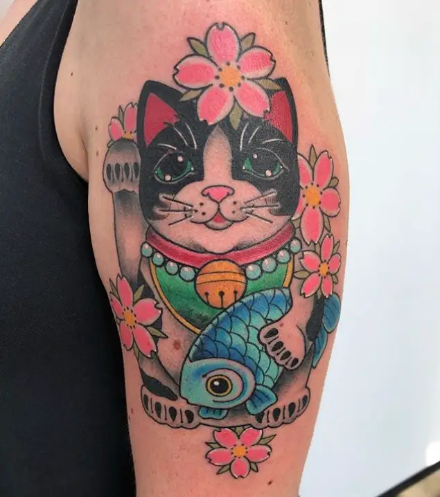 A black and white Lucky Cat with sakura flowers Tattoo on the shoulder