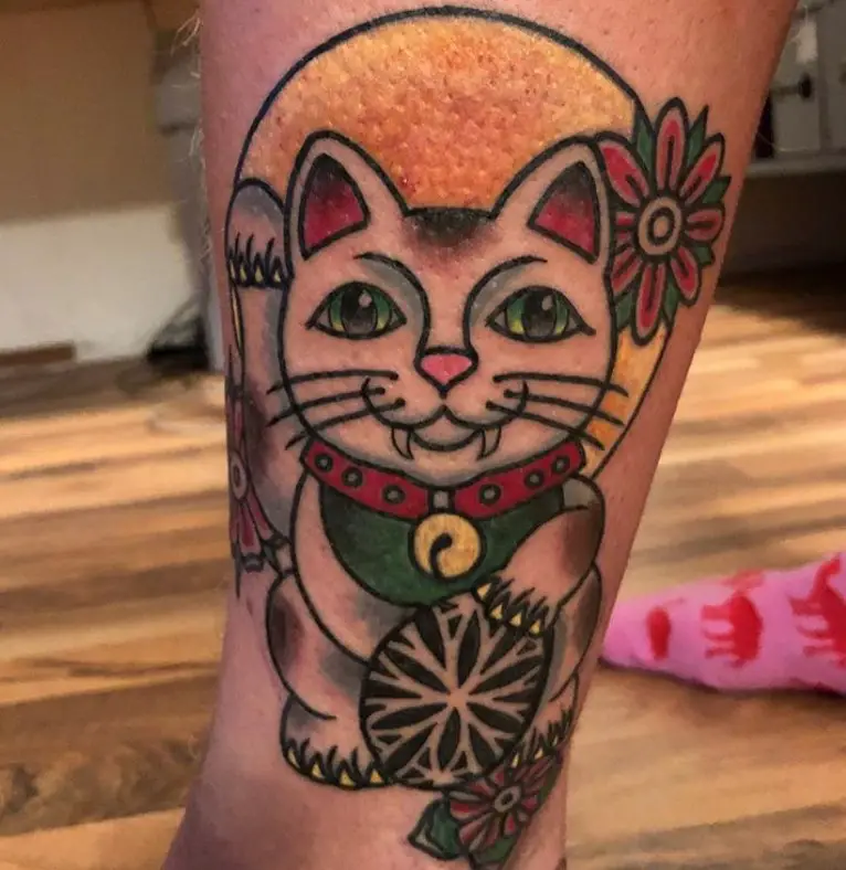 A Lucky Cat Tattoo on the leg
