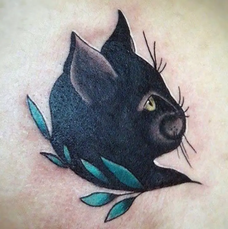 sideview face of black cat with green leaves tattoo