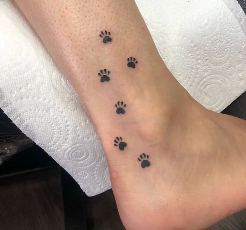small Paw Prints Tattoo on the ankle