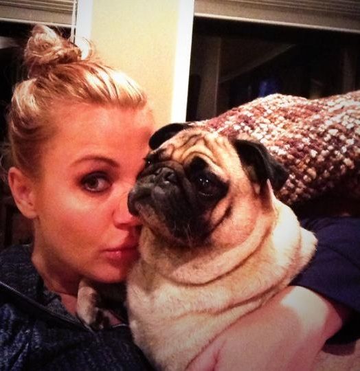 Michelle Beadle hugging her pug