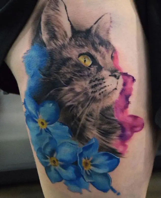 Realistic Cat with blue and pink flowers tattoo on the leg