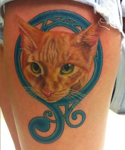 face of orange cat realistic Tattoo on the side of thighs