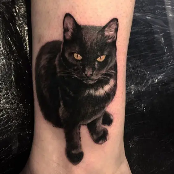 sitting Realistic black Cat Tattoo on the ankle