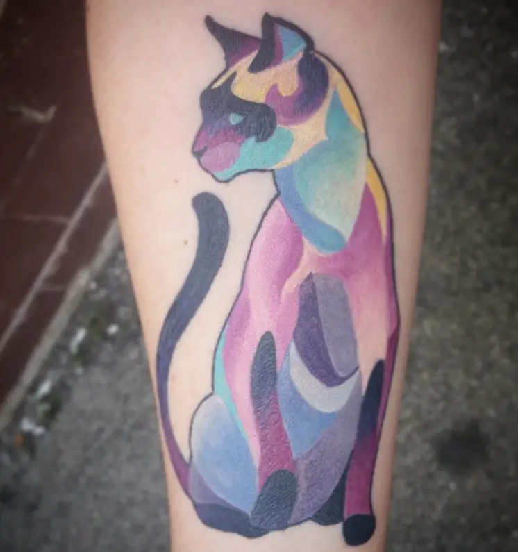 artistic and colorful sitting Siamese Cat tattoo on the lef