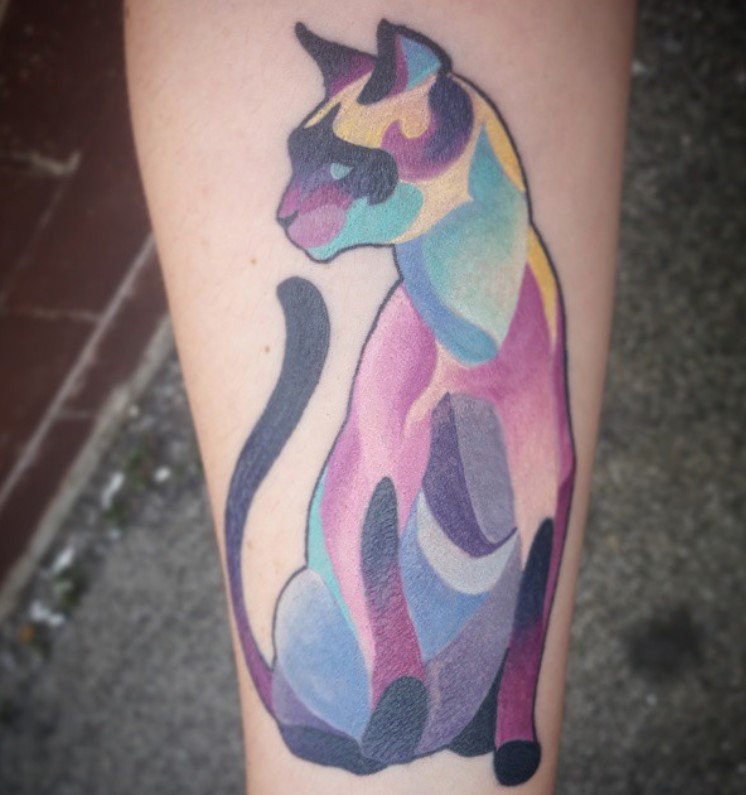 artistic and colorful sitting Siamese Cat tattoo on the lef