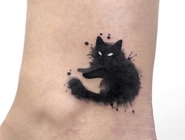watercolor black cat tattoo on ankles