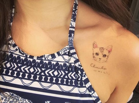 face of a cat tattoo on the shoulder