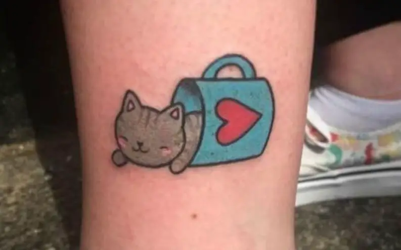 cute cat on a cup tattoo
