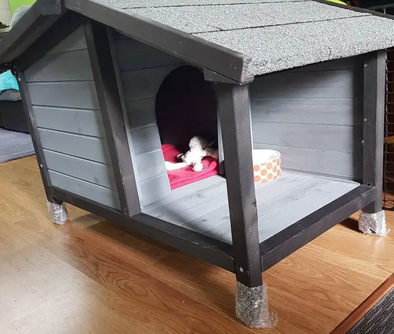 A gray modern dog house