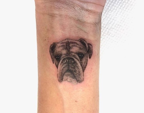 face of boxer dog tattoo on wrist
