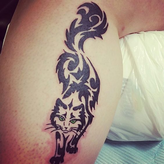 A Tribal Cat Tattoo on the leg
