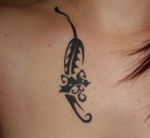 A Tribal Cat Tattoo on the chest of a woman