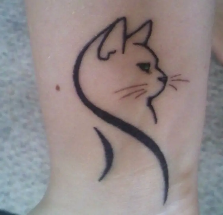 A sleek Tribal Cat Tattoo on the ankle