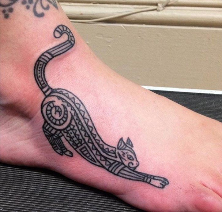 A Tribal Cat Tattoo on the foot