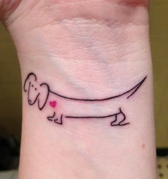 outline of a Wiener Dog tattoo on the wrist