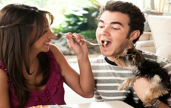 DANIELLE and KEVIN JONAS with their Yorkshire Terrier