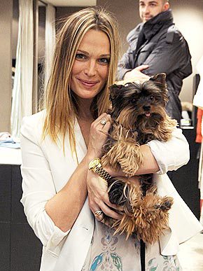MOLLY SIMS holding her Yorkshire Terrier