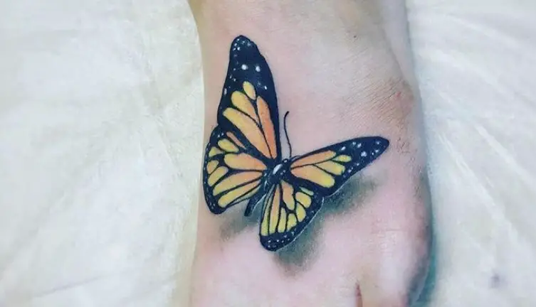 Realistic Monarch butterfly tattoo on feet