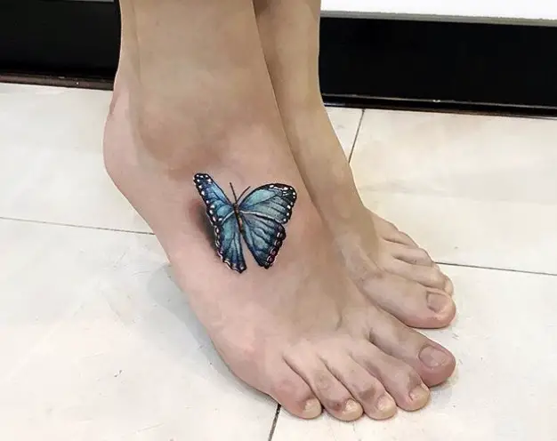blue 3D butterfly tattoo on feet