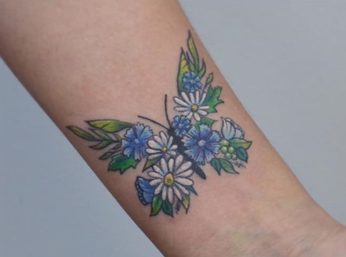 Butterfly with flowers and leaves wings tattoo on wrist