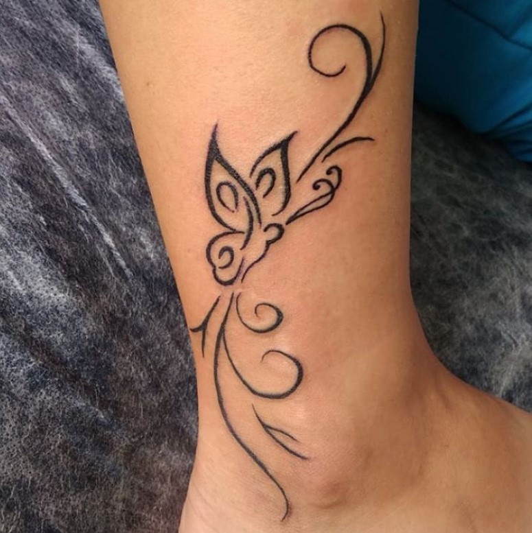 simple curvy butterfly tattoo on ankle