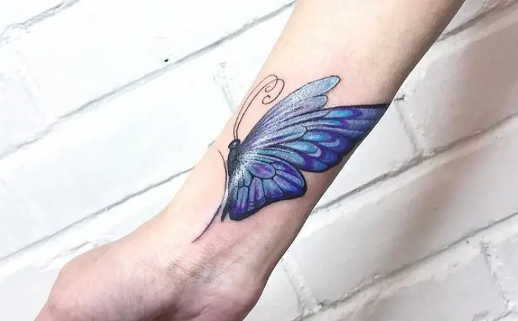 Blue Butterfly tattoo on wrist
