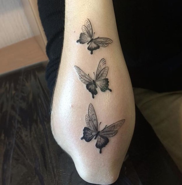 Three butterfly tattoo on forearm