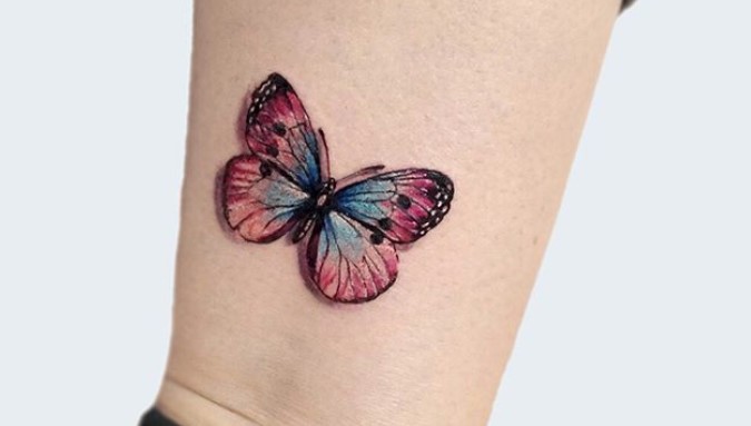 cute and colorful butterfly tattoo on ankle