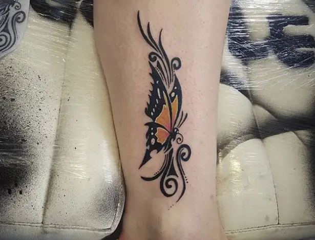 Tribal butterfly tattoo on ankle
