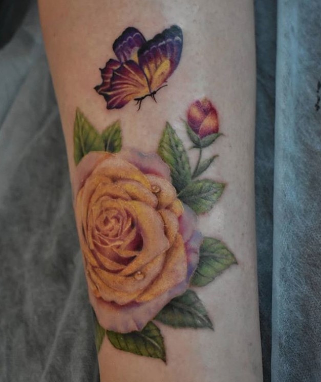 colorful butterfly and roses tattoo on forearm