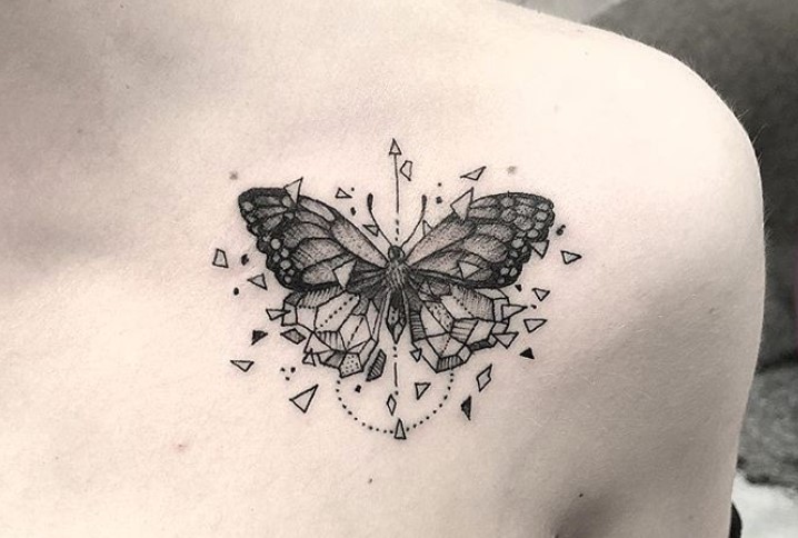 Geometric butterfly tattoo on shoulder