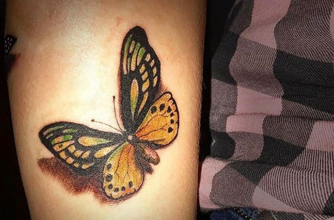 Yellow and green butterfly tattoo