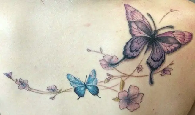 Pink and purple butterflies with flowers tattoo