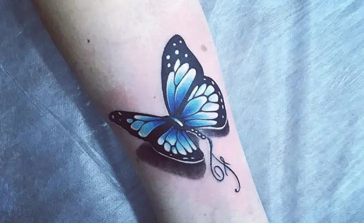 Blue 3D butterfly tattoo on wrist