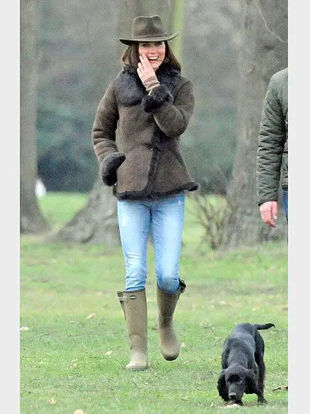 Duchess Kate walking in the field with her Cocker Spaniel
