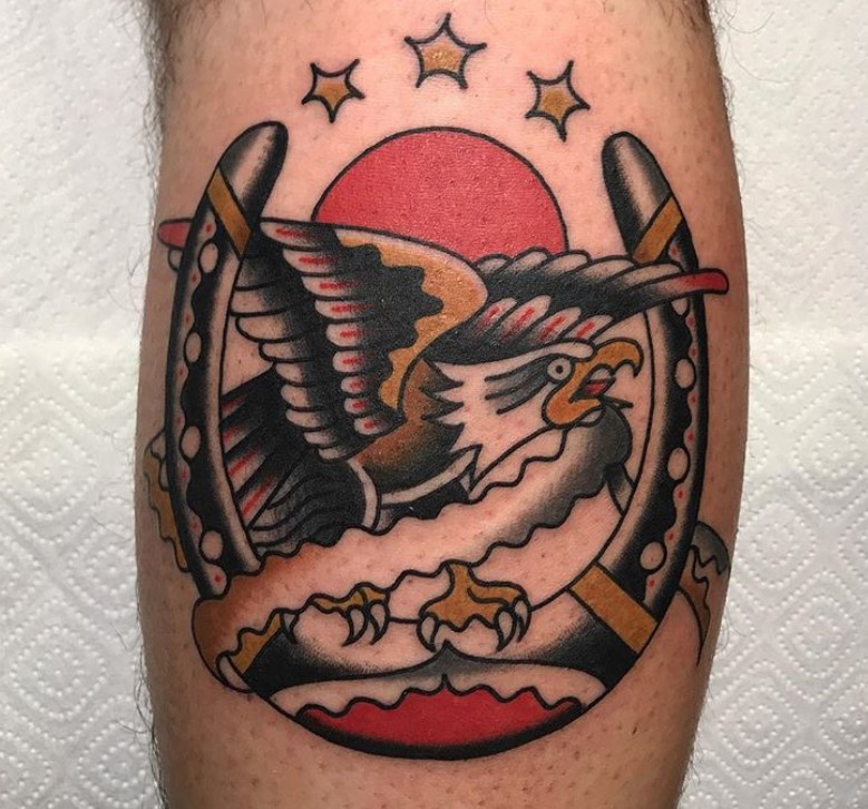 Traditional eagle tattoo. on the leg