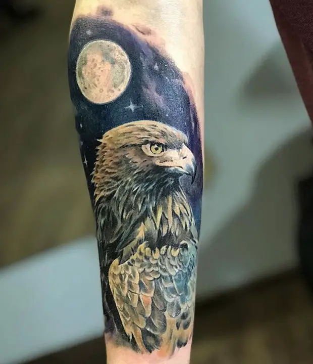reaslistic Eagle Tattoo at night with dark sky and moon with stars tattoo on the forearm