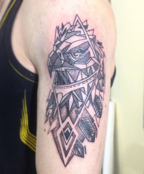 Geometric head of an eagle on the shoulder